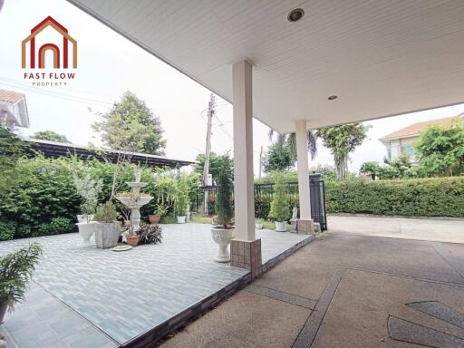 Spacious outdoor area with a driveway and garden