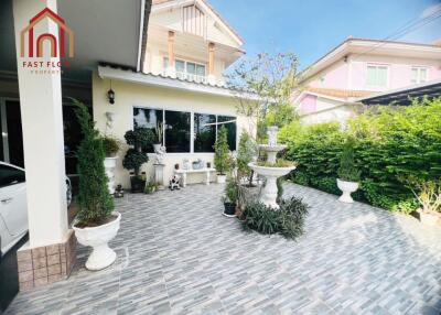 Outdoor garden patio with decorative plants and fountain