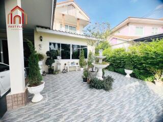 Outdoor garden patio with decorative plants and fountain