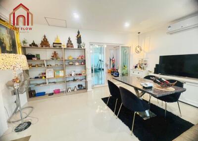 Modern living room with dining area and TV