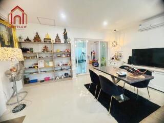 Modern living room with dining area and TV