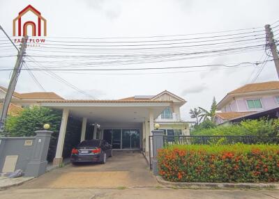 Front view of a house with garage and driveway