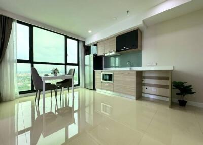 Modern kitchen with dining area and large window