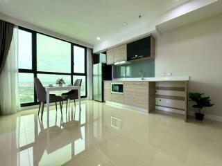 Modern kitchen with dining area and large window