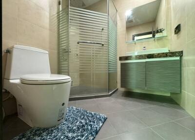 Modern bathroom with glass shower and floating vanity