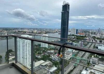 High-rise balcony with city and river view