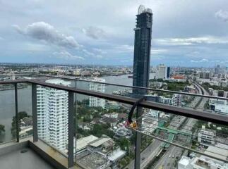 High-rise balcony with city and river view