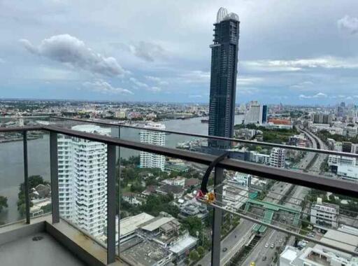 High-rise balcony with city and river view