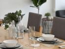 Dining table set with dishes and glasses