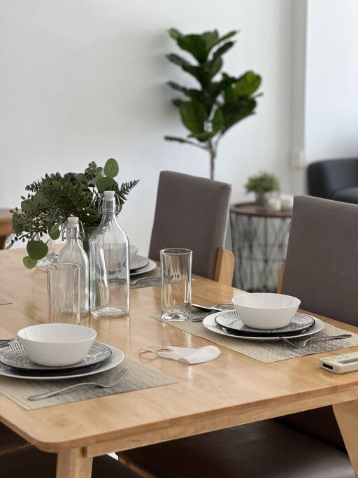 Dining table set with dishes and glasses