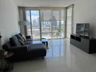 Living room with large windows and cityscape view