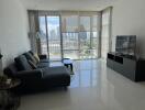 Living room with large windows and cityscape view