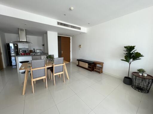 Modern living room with dining area and kitchen