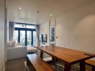 Living room with large windows and modern furniture