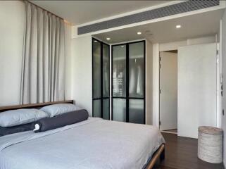 Modern bedroom with bed and closet