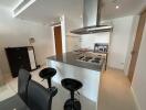 Modern kitchen with breakfast bar and appliances