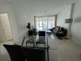 Spacious living room with a dining area and city view