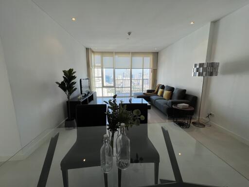 Spacious living room with city view through large windows