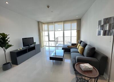 Modern living room with large windows and contemporary furniture