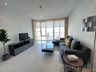 Modern living room with large windows and contemporary furniture