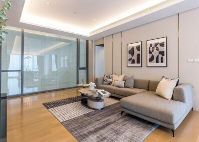 Modern living room with sectional sofa and glass partition