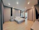 modern bedroom with double bed, nightstands, and large windows