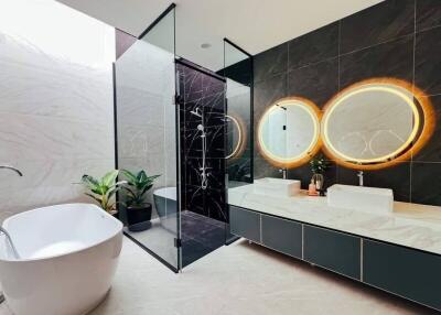 modern bathroom with freestanding tub and glass shower