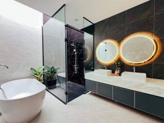 modern bathroom with freestanding tub and glass shower