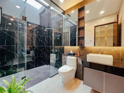 Modern bathroom with glass shower and elegant fixtures