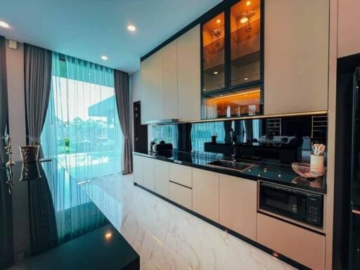 Modern kitchen with built-in appliances and island counter