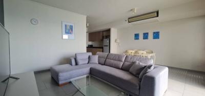 modern living room with gray sectional sofa and dining area