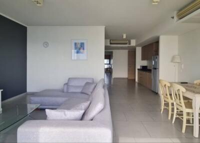 Spacious living area with modern furniture and integrated dining space