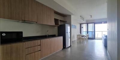 Open plan kitchen and living area with natural light