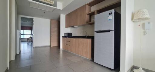 Modern kitchen with wooden cabinetry and appliances