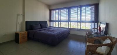 Spacious bedroom with large windows