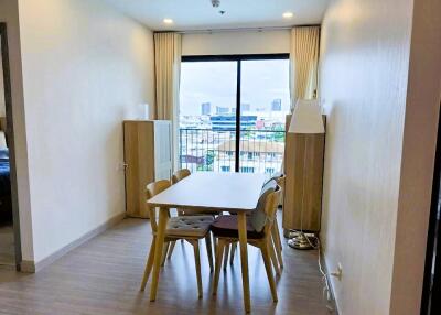 Dining area with a table and chairs near a window