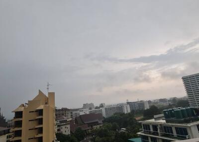 Overview of residential and commercial buildings with cloudy sky