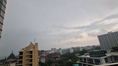 Overview of residential and commercial buildings with cloudy sky