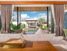 Living room with open view of a pool and outdoor seating area