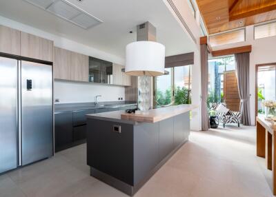 Modern kitchen with island and large windows