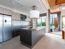 Modern kitchen with island and large windows