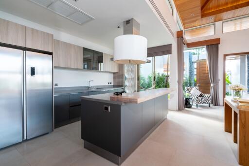 Modern kitchen with island and large windows