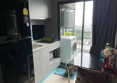 Modern kitchen with large window and washing machine