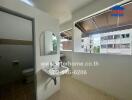 Bathroom with wall-mounted sink and mirror