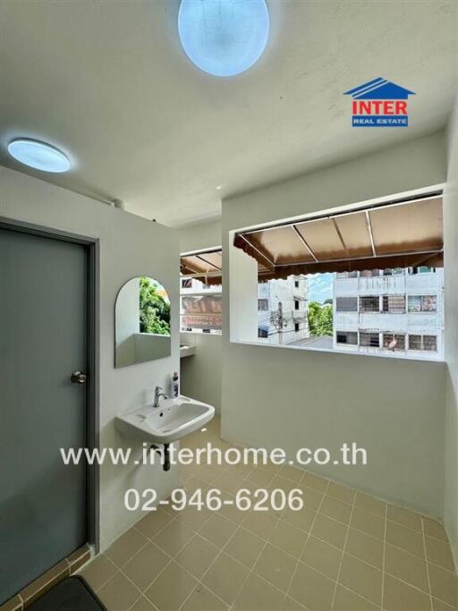 Well-lit bathroom with a sink and mirror