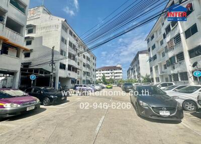 Outdoor view of apartments with parked cars