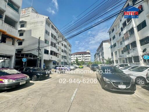 Outdoor view of apartments with parked cars