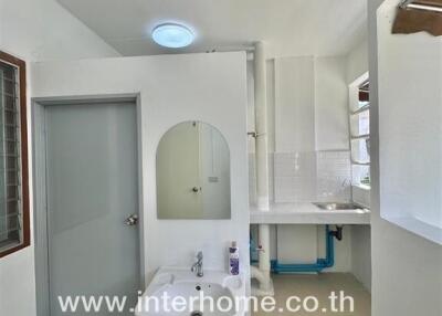 Bathroom with sink, mirror, and shower