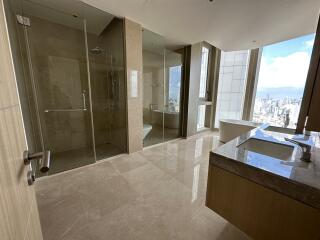 Spacious modern bathroom with city view