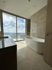 Modern bathroom with large window and city view